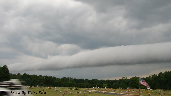 Ugly storm front coming across cemetery.