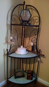 Decorative Stand With Mixed Culture Items.