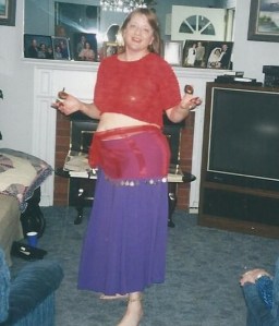 Me at 40 belly dancing for my parents with zils.