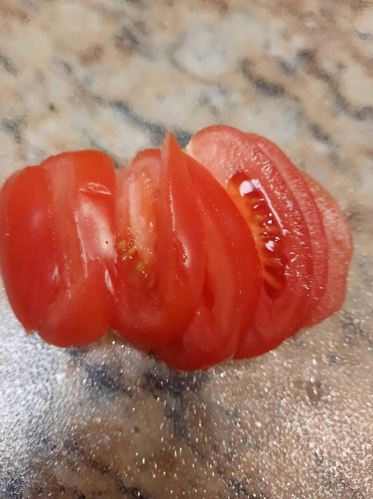 A sliced Roma Tomato